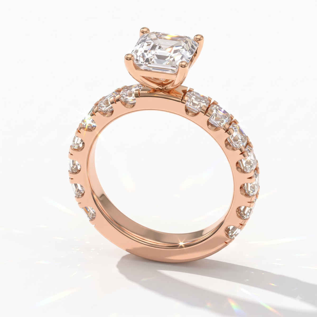 Asscher cut lab-grown diamond engagement ring with Asscher side stones in 14K (585) rose gold, angled view 