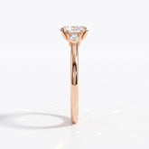 Oval cut lab-grown diamond three-stone engagement ring with pear side stones in 14K (585) rose gold, side view 
