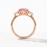 Fancy Vivid Pink pear cut lab-grown diamond three-stone ring with pear side diamonds in 14K (585) rose gold, upright profile view 