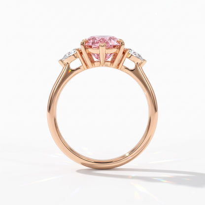 Fancy Vivid Pink pear cut lab-grown diamond three-stone ring with pear side diamonds in 14K (585) rose gold, upright profile view 