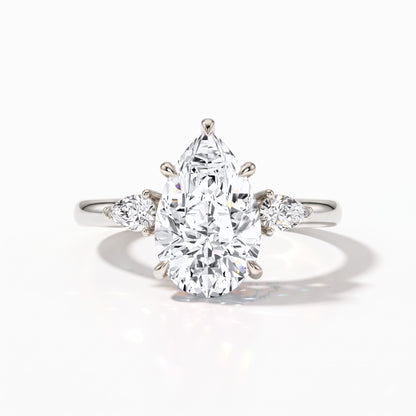 Pear cut lab-grown diamond three-stone engagement ring with pear side stones in 14K (585) white gold, front view 