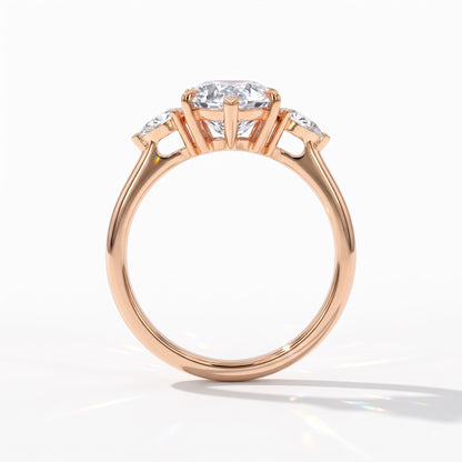 Pear cut lab-grown diamond three-stone engagement ring with pear side stones in 14K (585) rose gold, upright profile view 