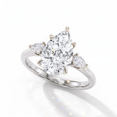 Pear cut lab-grown diamond three-stone engagement ring with pear side stones in 14K (585) white gold, angled view 