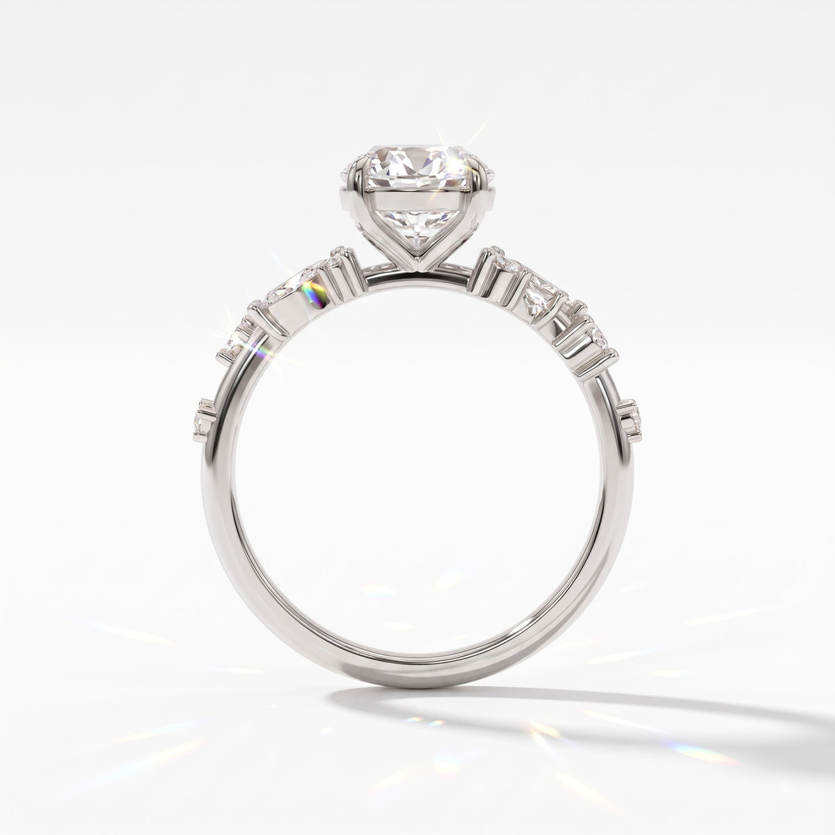 Oval lab-grown diamond cluster engagement ring with marquise and round leaf accents in 14K (585) white gold, upright profile view 