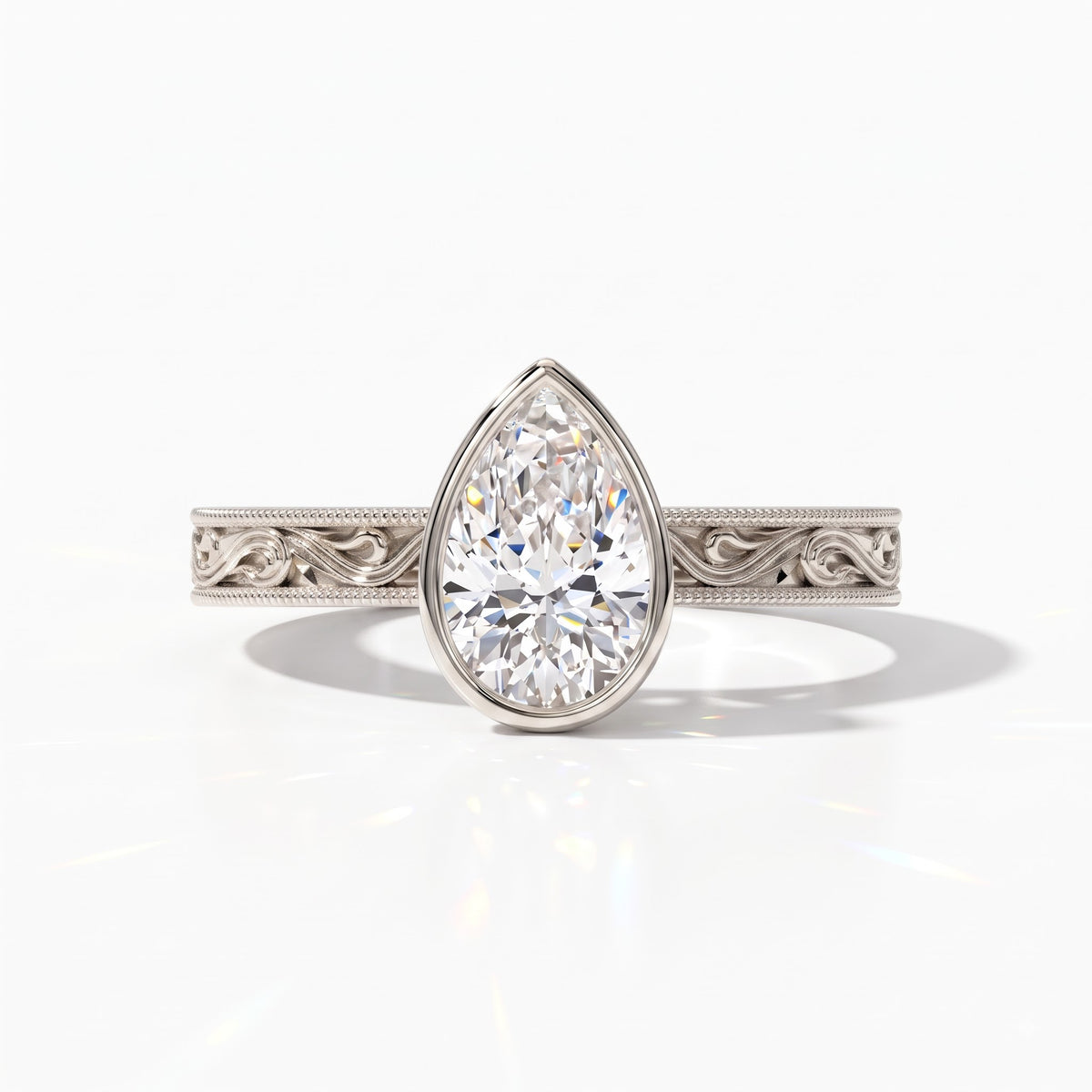 Pear cut lab-grown diamond vintage bezel engagement ring with hand-engraved milgrain band in 14K (585) white gold, front view 
