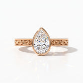 Pear cut lab-grown diamond vintage bezel engagement ring with hand-engraved milgrain band in 14K (585) rose gold, front view 
