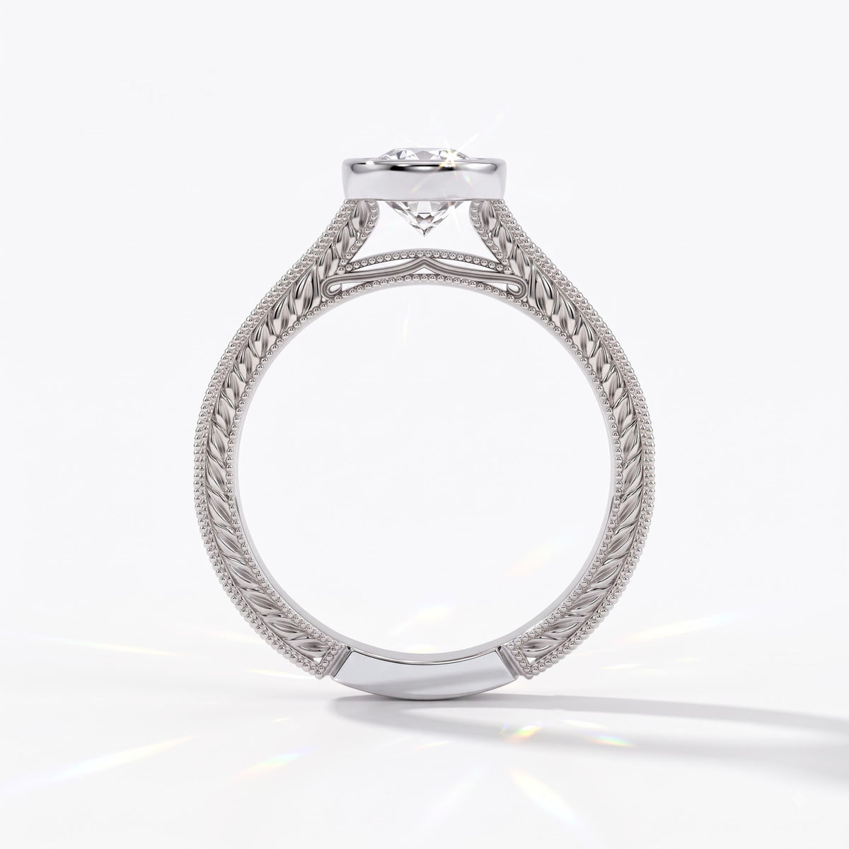 Pear cut lab-grown diamond vintage bezel engagement ring with hand-engraved milgrain band in 14K (585) white gold, upright profile view 