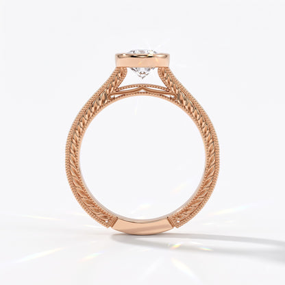 Pear cut lab-grown diamond vintage bezel engagement ring with hand-engraved milgrain band in 14K (585) rose gold, upright profile view 