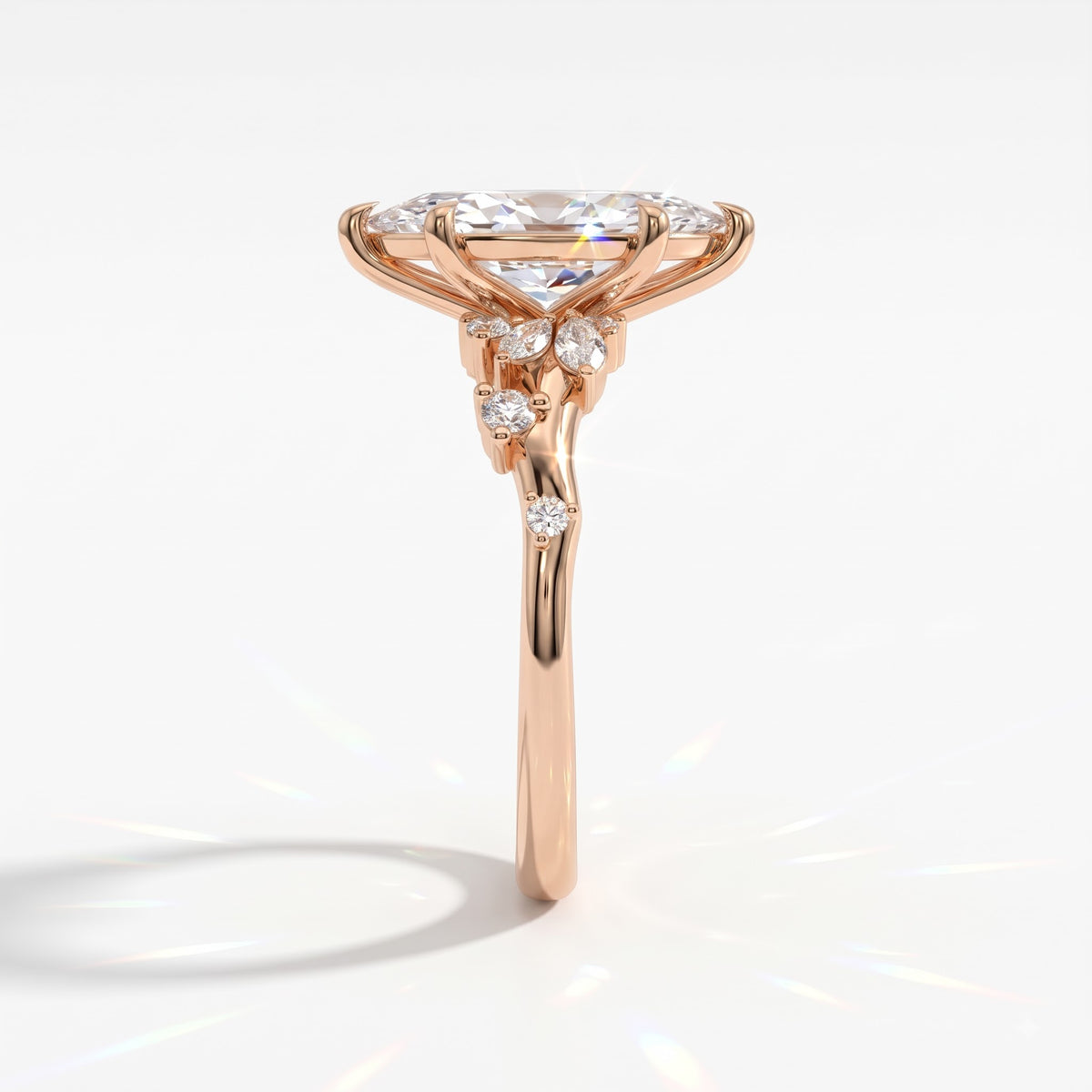 Marquise cut lab-grown diamond cluster engagement ring with marquise and round leaf accents in 14K (585) rose gold, side view 