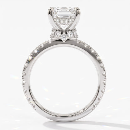 Emerald cut lab-grown diamond hidden halo collar engagement ring with pavé band in 950 platinum, upright profile view 