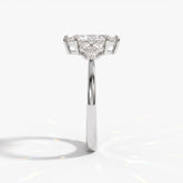 Marquise cut lab-grown diamond leaf cluster engagement ring with marquise and round accents in 950 platinum, side view 