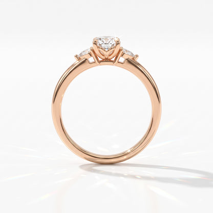 Oval cut lab-grown diamond three-stone engagement ring with pear side stones in 18K (750) rose gold, upright profile view 