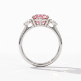 Fancy Vivid Pink pear cut lab-grown diamond three-stone ring with pear side diamonds in 18K (750) white gold, upright profile view 