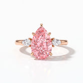 Fancy Vivid Pink pear cut lab-grown diamond three-stone ring with pear side diamonds in 18K (750) rose gold, front view 