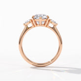 Pear cut lab-grown diamond three-stone engagement ring with pear side stones in 18K (750) rose gold, upright profile view 