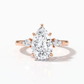 Pear cut lab-grown diamond three-stone engagement ring with pear side stones in 18K (750) rose gold, front view 