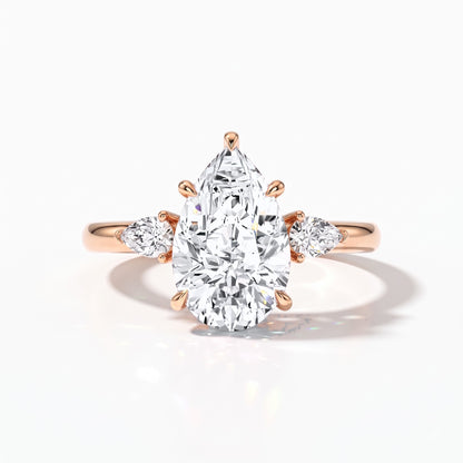 Pear cut lab-grown diamond three-stone engagement ring with pear side stones in 18K (750) rose gold, front view 