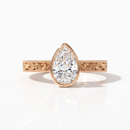 Pear cut lab-grown diamond vintage bezel engagement ring with hand-engraved milgrain band in 18K (750) rose gold, front view 