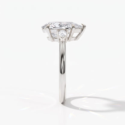 Pear cut lab-grown diamond three-stone engagement ring with pear side stones in 950 platinum, side view 