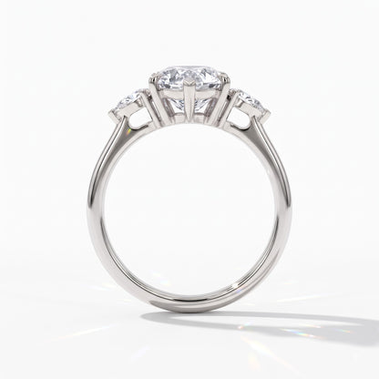 Pear cut lab-grown diamond three-stone engagement ring with pear side stones in 950 platinum, upright profile view 