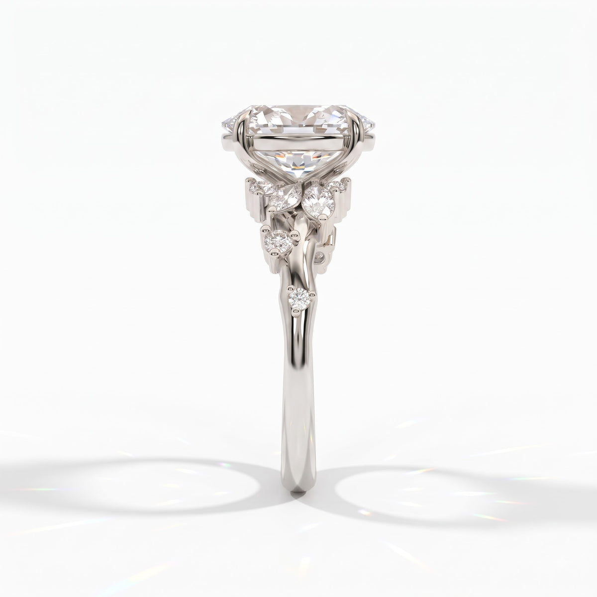 Oval lab-grown diamond cluster engagement ring with marquise and round leaf accents in 950 platinum, side view 