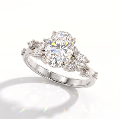 Oval lab-grown diamond cluster engagement ring with marquise and round leaf accents in 950 platinum, angled view 