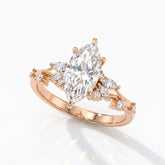 Marquise cut lab-grown diamond cluster engagement ring with marquise and round leaf accents in 18K (750) rose gold, angled view 