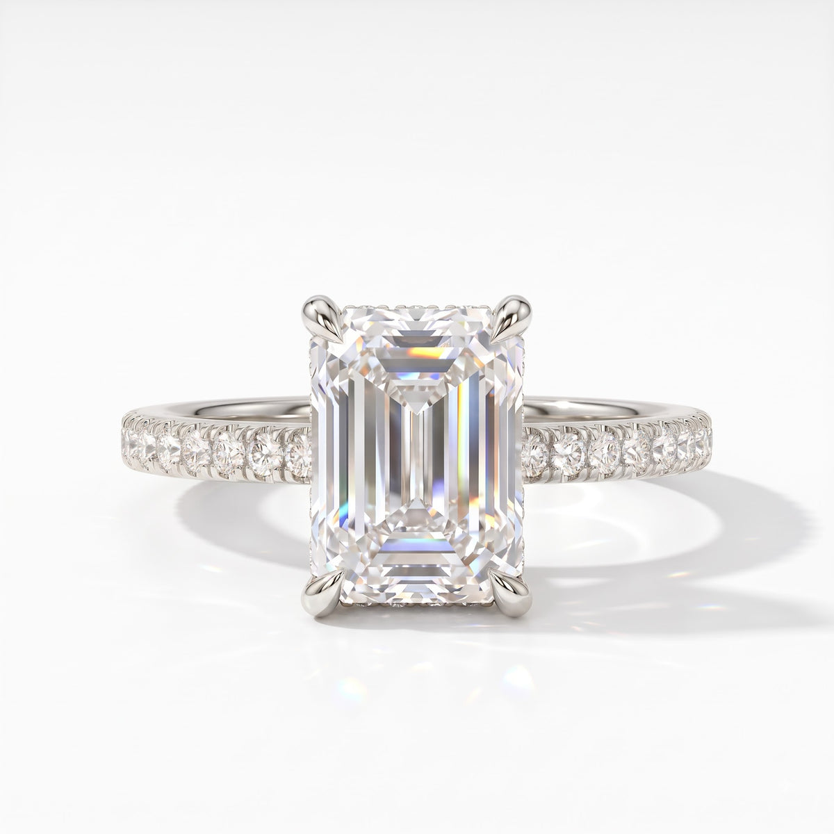 Emerald cut lab-grown diamond hidden halo engagement ring with pavé band in 14K (585) white gold, front view 