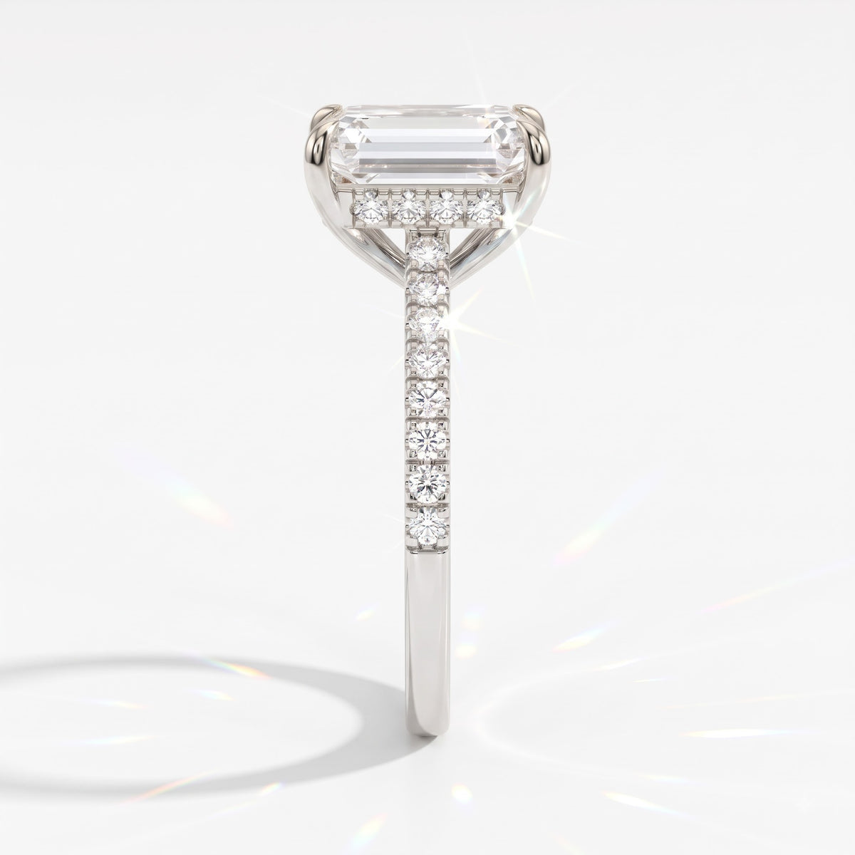 Emerald cut lab-grown diamond hidden halo engagement ring with pavé band in 18K (750) white gold, side view 