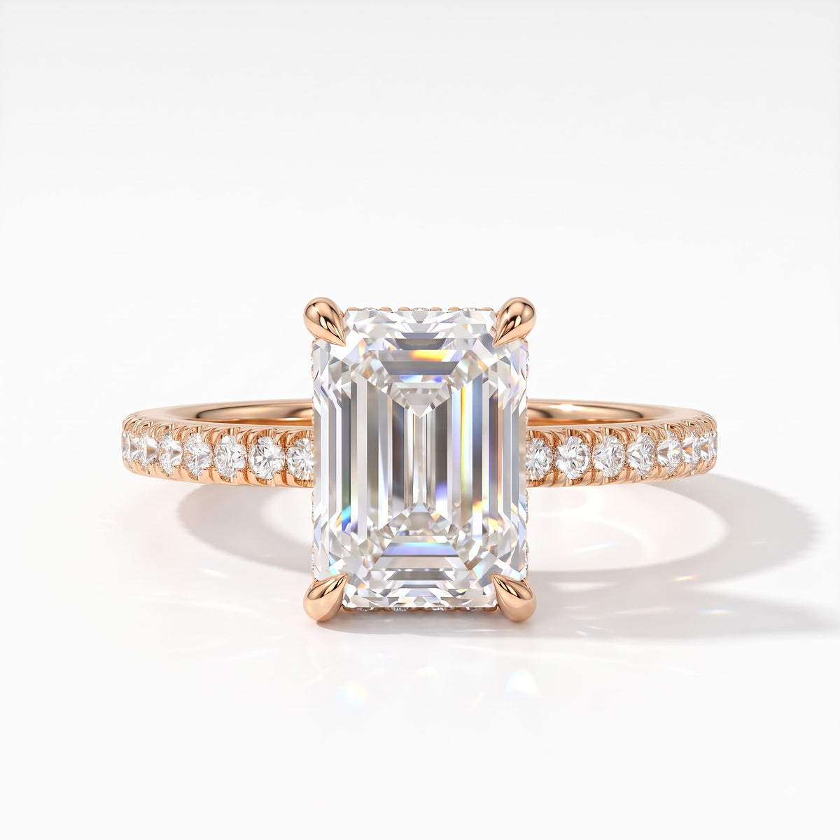Emerald cut lab-grown diamond hidden halo engagement ring with pavé band in 18K (750) rose gold, front view 