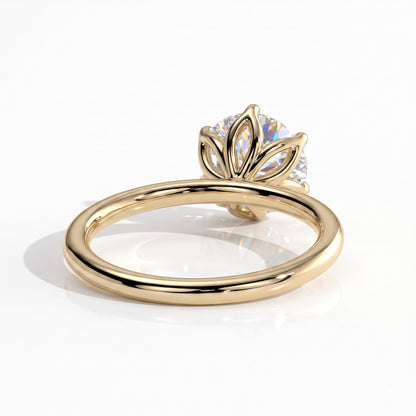 Round lab-grown diamond solitaire engagement ring in 18K (750) yellow gold, on white background 