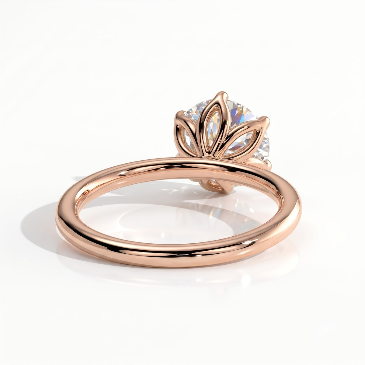 Round lab-grown diamond solitaire engagement ring in 18K (750) rose gold, on white background 