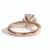 Round lab-grown diamond solitaire engagement ring in 14K (585) rose gold, on white background 