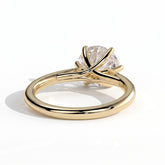 Round lab-grown diamond solitaire engagement ring in 18K (750) yellow gold, on white background 