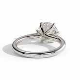 Round lab-grown diamond solitaire engagement ring in 18K (750) white gold, on white background 
