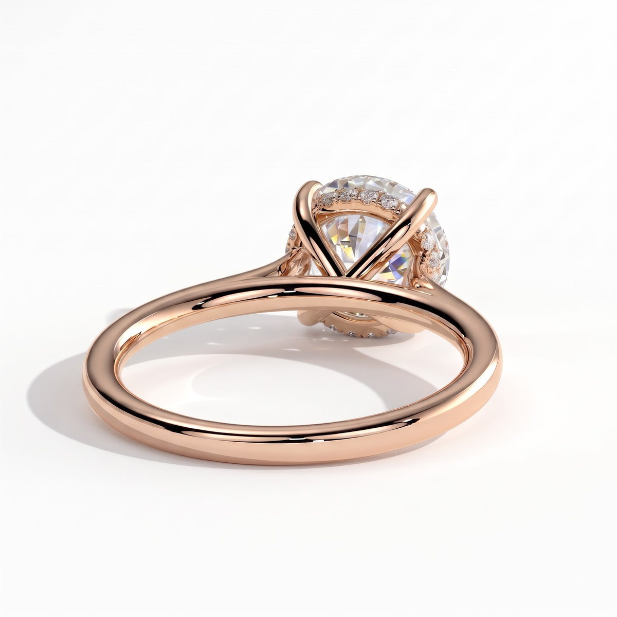 Round lab-grown diamond solitaire engagement ring in 14K (585) rose gold, on white background 