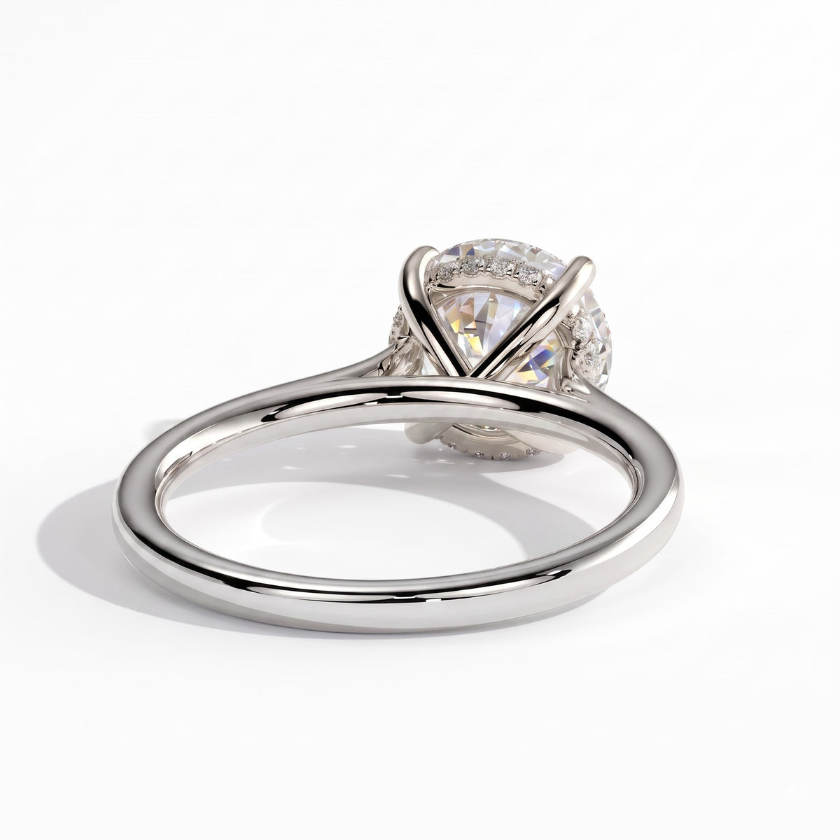 Round lab-grown diamond solitaire engagement ring in 950 platinum, on white background 