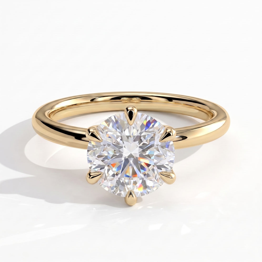 Round lab-grown diamond solitaire engagement ring in 14K (585) yellow gold, front view 