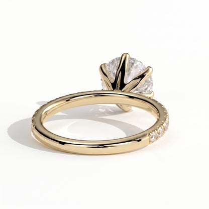 Round lab-grown diamond halo engagement ring in 14K (585) yellow gold, on white background 