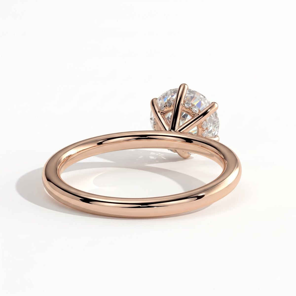 Round lab-grown diamond solitaire engagement ring in 14K (585) rose gold, on white background 