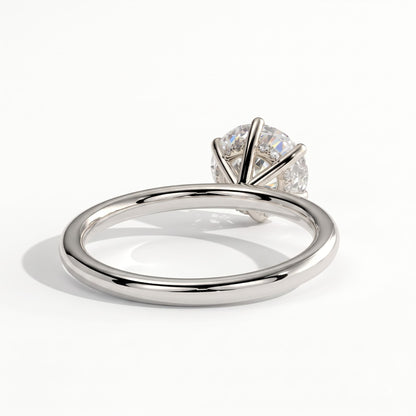 Round lab-grown diamond solitaire engagement ring in 950 platinum, on white background 