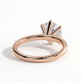 Round lab-grown diamond halo engagement ring in 14K (585) rose gold, on white background 
