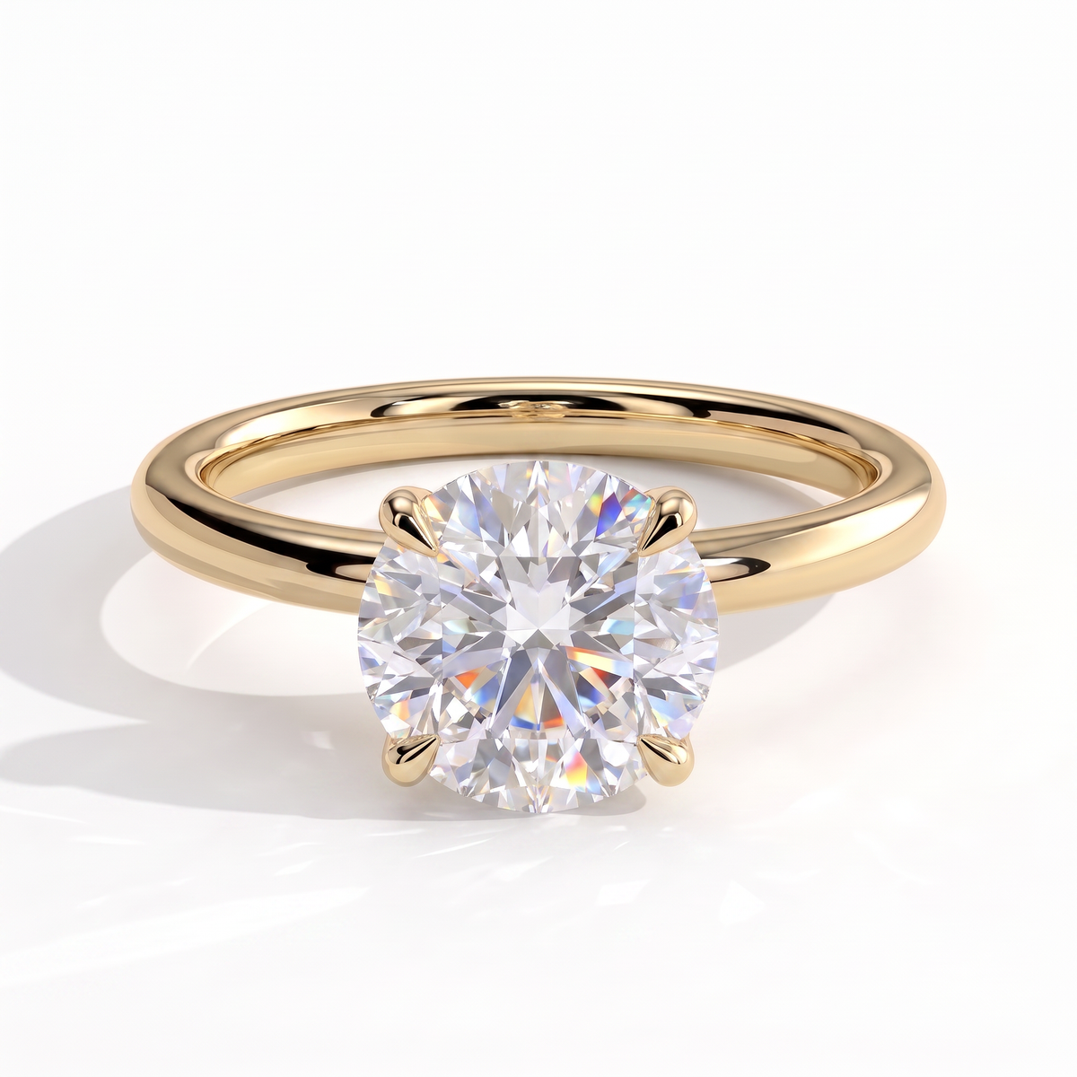 Round lab-grown diamond solitaire engagement ring in 14K (585) yellow gold, front view 