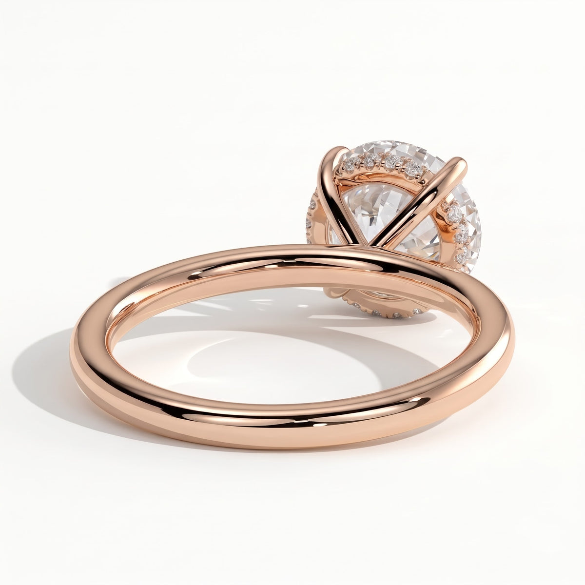 Round lab-grown diamond solitaire engagement ring in 14K (585) rose gold, on white background 