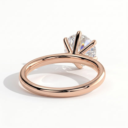 Round lab-grown diamond halo engagement ring in 18K (750) rose gold, on white background 