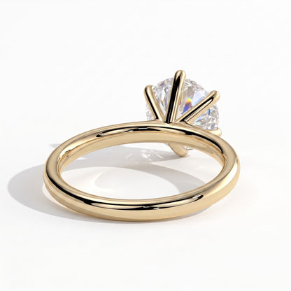 Round lab-grown diamond halo engagement ring in 18K (750) yellow gold, on white background 