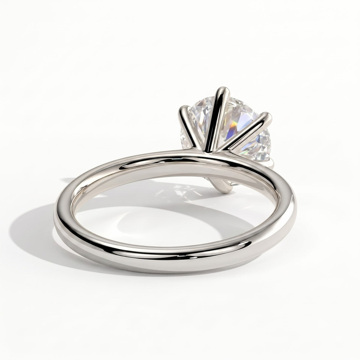 Round lab-grown diamond halo engagement ring in 950 platinum, on white background 