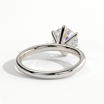Round lab-grown diamond halo engagement ring in 950 platinum, on white background 