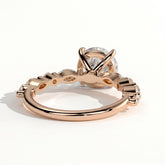 Round lab-grown diamond halo engagement ring in 18K (750) rose gold, on white background 
