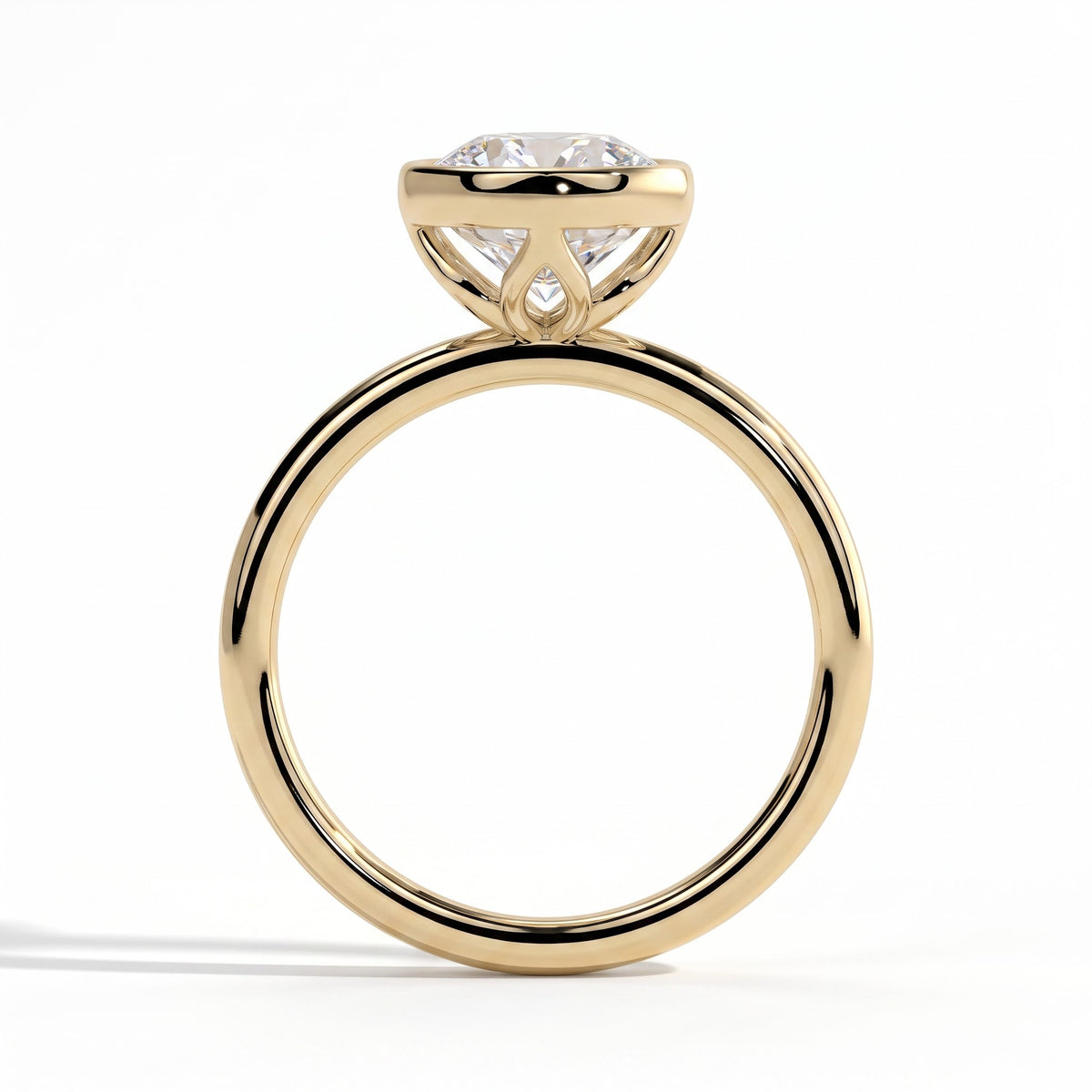 Round lab-grown diamond bezel-set solitaire engagement ring in 14K (585) yellow gold, side profile 